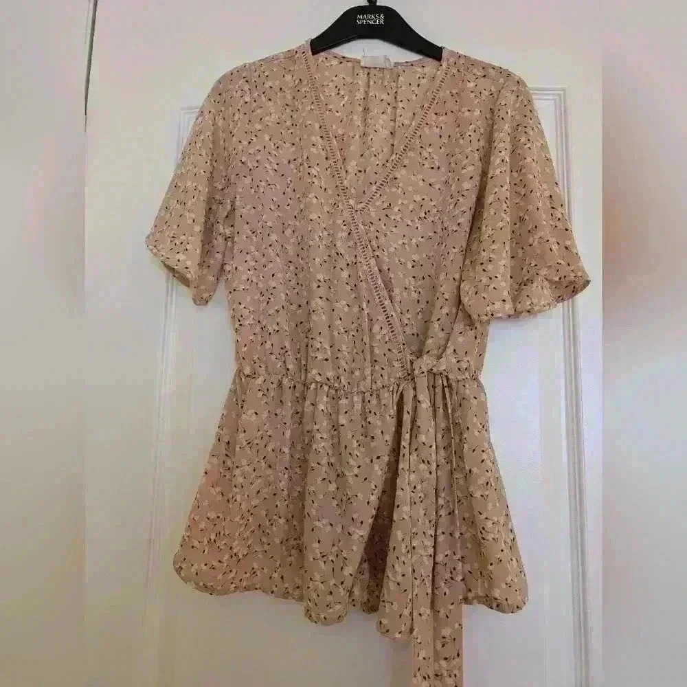 Sienna sky size medium pink blouse with white flowers